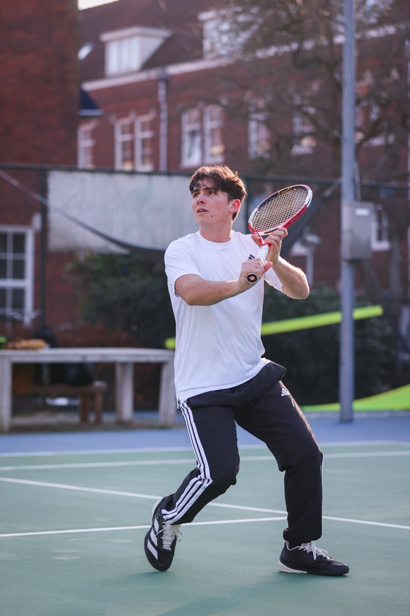 Noah Cladera, founder of Contakt, on a tennis court